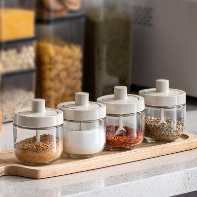 China Kitchen Spice Salt Shaker Lid with Spoon Household Salt Sugar Oil Jar Kitchen Spice Seasoning Glass Set for sale