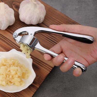 China Stainless Steel Viable Color Garlic Press Household Manual Thickening Garlic Lady Garlic Mashed Zinc Alloy for sale