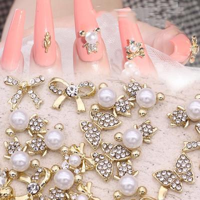 China Flatback Shinny Gold Alloy Bow Ties Diamond Pearls Nail Jewelry Rhinestone For Nail Beauty Decoration for sale