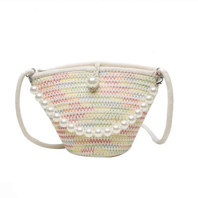 China Fashion straw wholesale woven bag the new pearl chain bucket bag Korean version of the wave of the simple fashion beach bag for women for sale