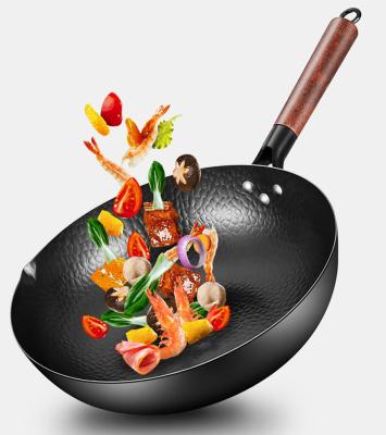 China Stocked Traditional Hand Hammered Carbon Steel Pan Wok With Healthy Removable Beech Wood Handle for sale