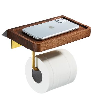 China Modern Bathroom Accessories Paper Holder Walnut Gold Paper Towel Rack Wooden Toilet Paper Holder With Phone Shelf for sale