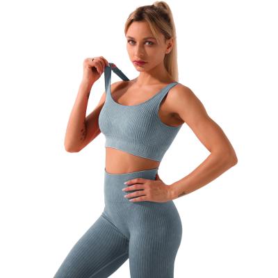 China Vintage Fashion Womens Gym Set Seamless Hollow Out Womens Sports Gym Wear Tights And Bra 2 Piece Yoga Set for sale