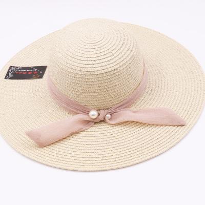 China New fashion character women's beach paper hat women's wide brim color straw hat sunshade beach sunshade for sale