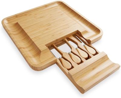 China Traditional Bamboo Wooden Charcuterie Slide-Out Magnetic Drawers Cheese Board Set With Ceramic Cutlery Bowls And Knife for sale