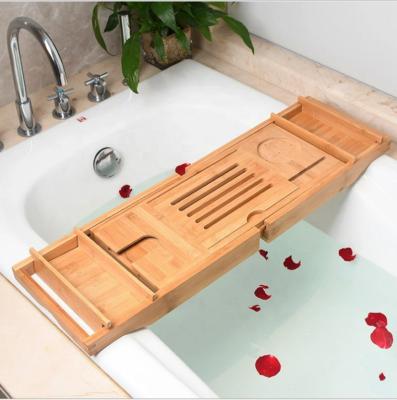 China Hot Selling Sustainable Bamboo Tub Caddy Tray Adjustable Bath Caddy Bridge With Expandable Arms for sale