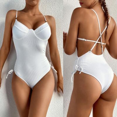 China Breathable Solid One Piece Hollow White Ribbed Swimwear Girls And Beach Wear Sexy Bikinis Swimsuits For Women Overalls Bathing Suit 2021 for sale