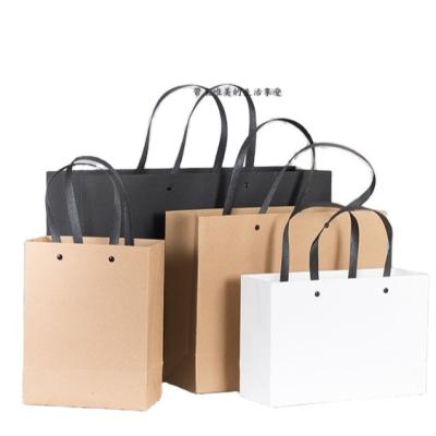 China Logo Kraft Paper Clothing Tote Handbag Black White Paper Gift Shopping Bags Recyclable Custom Advertising Bag for sale