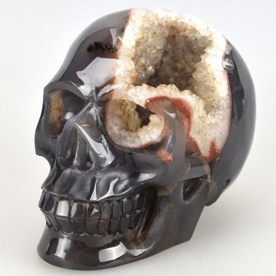 China China 100% Natural Wholesale Hand Carved Crystal Geode Skull for sale