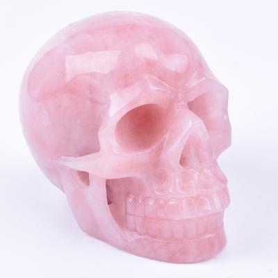 China Europe Hand Carved Natural Realistic Rose Quartz Crystal Skull Healing Stone for sale