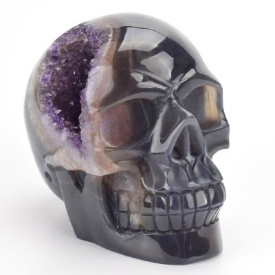 China Europe Ore Natural Semi Precious Stone Hand Carved Realistic Agate Amethyst Geode Crystal Skull for sale