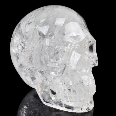 China China Super Quality Hand Carved Aura Natural Skull Head Large Clear Quartz Crystal Skull for sale