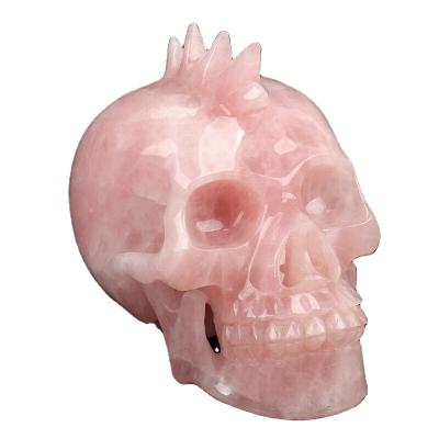 China Europe Ore Natural Semi Precious Stone Hand Carved Rose Quartz Realistic Mohawk Crystal Skull for sale