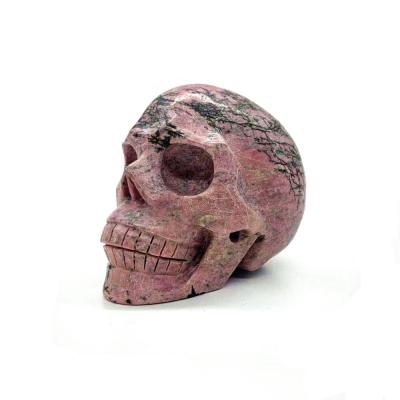 China Europe wholesale natural rhodonite crystal skulls crystal carving pink carved crystal crafts for decoration for sale