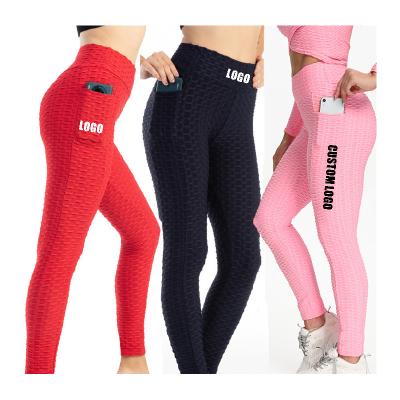 China Antibacterial seamless women gym pants with pocket fitness yoga wear plus size sports sweatpants yoga leggings for women tiktok leggings yoga pants for sale