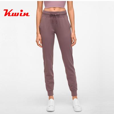 China Custom Anti-Wrinkle Women Gym Gaiters Leisure Sweatpants With Drawstring Plain Trousers With Logo Label Print for sale