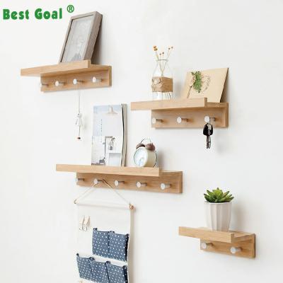 China Creative Solid Wood Wooden Wall Hanging Clothing Wall Shelf Viable Bedroom With Coat Hooks for sale