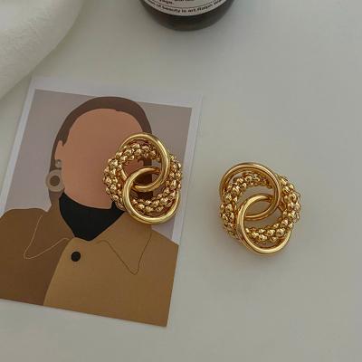 China Vintage Retro Metal Circle Personality Atmosphere Fashion Needle Winding Cool Exaggerated Sterling Silver Earrings for sale