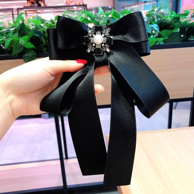 China Fashionable accessories fashion black pink crystal cross girl's pearl tie brooch pearl tie fabric butterfly bow ribbon silk lace brooch for sale