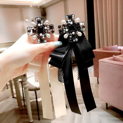 China Fashionable accessories fashion black pink crystal cross girl's pearl tie brooch pearl tie fabric butterfly bow ribbon silk lace brooch for sale