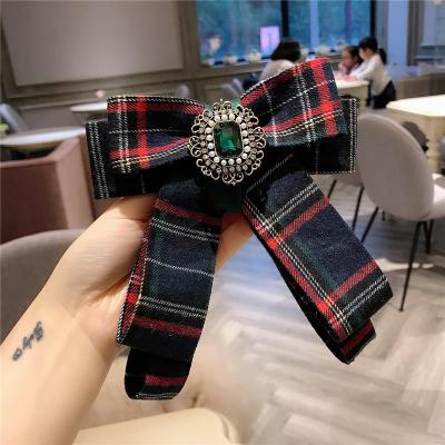 China Fashionable Exaggerated Striped Korea Gemstone Pearl Bow Tie Flower Pin Corsage Collar Needle Dress Accessories Big For Women Men Female for sale