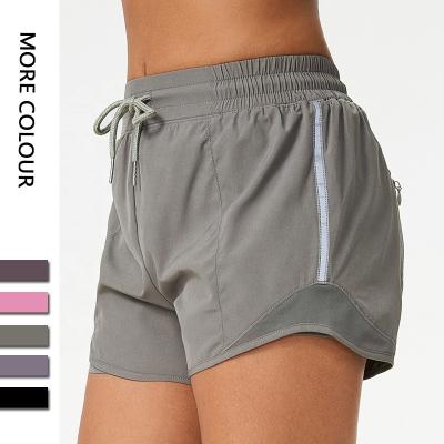 China Custom Logo Workout Women Breathable Performance Athletic Running Gym Shorts With Pocket Tape Womens Sports Yoga Reflective Shorts for sale