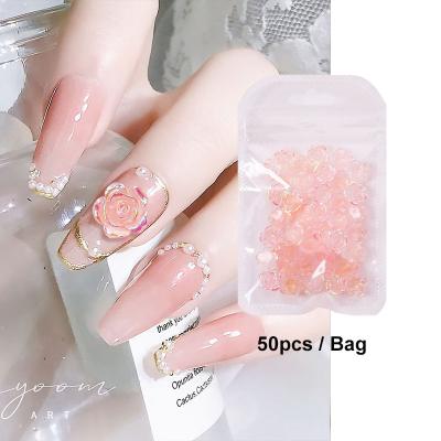 China Nail Art Nail Flower Aurora Charms 50pcs/bag Nail Art Camellia Decoration Resin Rose Pink 3D Flower Magic Color Nail Petal Charms for sale