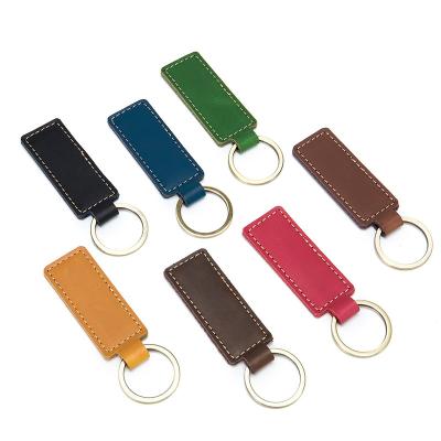 China Custom Vintage Logo Genuine Leather Vintage Handmade Cowhide Car Key Key Chain Holder for sale