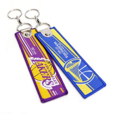 China Sports Wholesale Custom Design Basketball Key Team Logo Embroidered Fabric Woven Tag Chain for sale