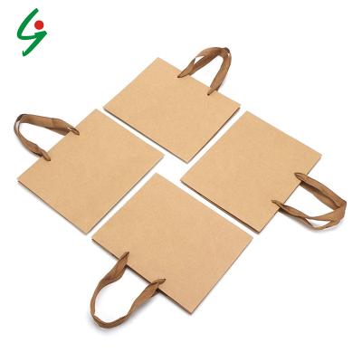 China Recyclable Kraft Paper Flat Bottom Boutique Custom Gift Paper Bag With Rope for sale