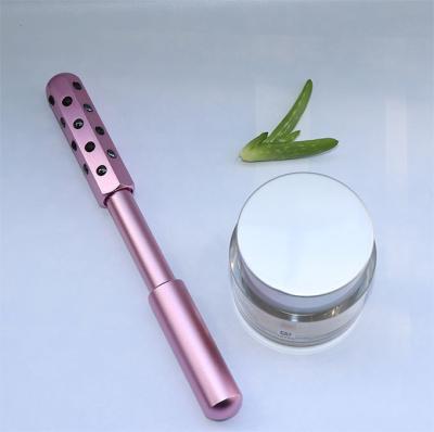 China Classic Anti-Puffiness 24ions Beauty Bar Skin Magnetic Energy Toning Roller 24K Gold Germanium Face Roller for sale