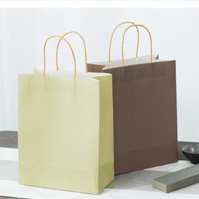 China Luxury Recycled Materials Kraft Paper Gift Bags With Your Own Logo And Twisted Paper Handle Packaging Clothes And Shoes for sale