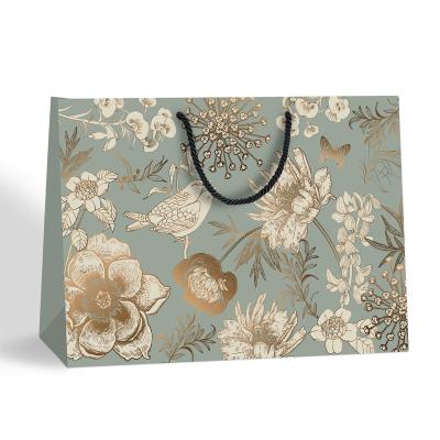 China Recycled Materials Luxury Paper Gift Bags With Handles Custom Your Own Logo Packaging Clothes for sale