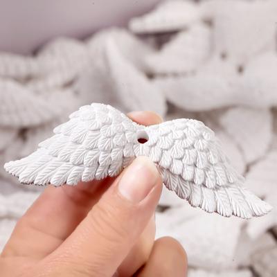 China Eco-friendly Car Air Freshener Car Perfume Accessories Aromatherapy Pendant Angel Wings Gypsum Car Diffuser for sale