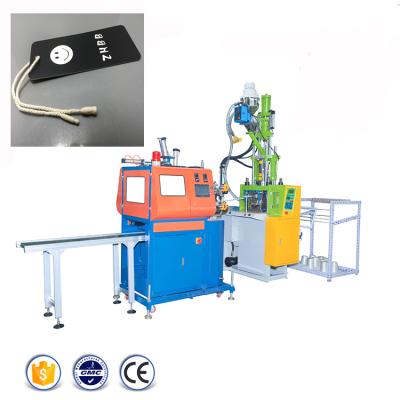 China VERTICAL Paper Seal Tag Ball Form Plastic Rope Hang Tag String Lock Garment Tag Injection Molding Machine for sale