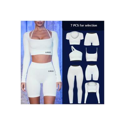 China 2022 Custom New Sportswear Women's Breathable Gym Workout Teams Bra Seamless Sexy Simple Crop Strap Yoga Top Set for sale