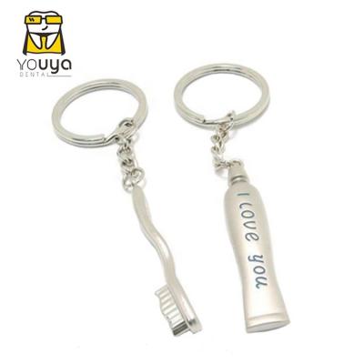 China Promotion Gift Factory Sales Dental Gift Toothpaste And Toothbrush Pendant Key Chain for sale