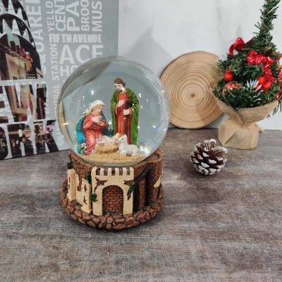 China Promotion Giftts Christmas Nativity Scene Snow Globe Music Box Resin Craft Beautiful for sale