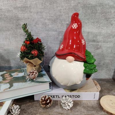 China Christmas Ornament Gnome Painted Statue Design Sandstone Santa Candy Jar Custom Ceramic Storage Container for sale