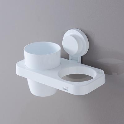 China Sustainable Functional Wall Mounted Suction Bathroom Plastic Hair Dryer Holder With Toothbrush Cup for sale