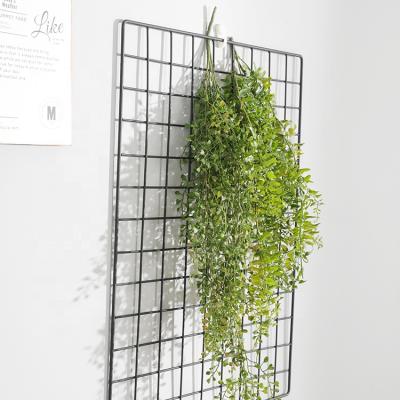 China Decorative Artificial Hanging Vines Wedding Lifelike Artificial Flower Plastic Vertical Wall Decoration Green Plants Wholesale for sale