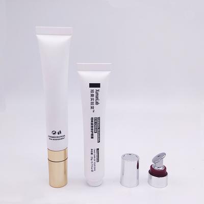 China Custom Cosmetics 15ml - 30ml Empty Lip Gloss Soft Squeeze Lip Packaging PE Eye Cream Container Cosmetic Tube With Zinc Alloy Applicator for sale