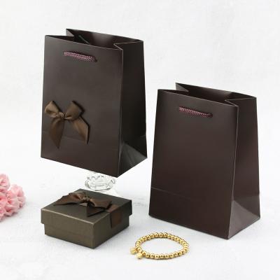 China Recyclable High Quality Custom Logos Paper Bags Gift Bag Designs And Bag for sale