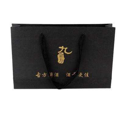 China Recycled Luxurious Black Tan Luxury Packaging Paper Bag Materials Cardboard Packaging Bag Shoes And Accessories for sale