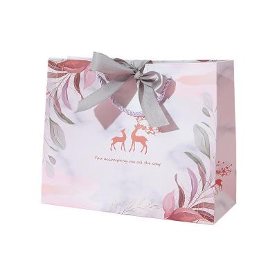 China Recyclable High Quality Custom Logos Paper Bags Gift Bag Designs And Bag for sale