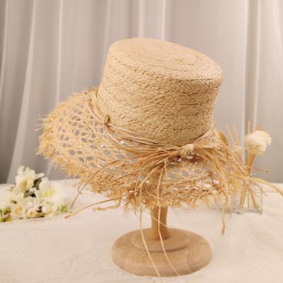 China New Character Collection Raffia Hat Handmade Woven Customs Color Girls Hollow Out Summer Hats Overflow Rough Brim Hat for sale