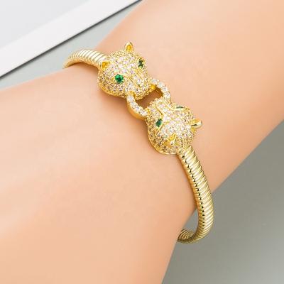 China Gold Plated European High Quality Gold Bracelet Green Eye Leopard Head Gold Personality Zircon Bracelets Bracelet for sale