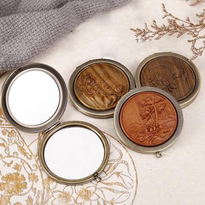 China Personalized Vintage Wood Carving Makeup Folding Mirror Round Portable Double Mirrors Sandalwood MINI Pocket Mirror Gift Set for sale