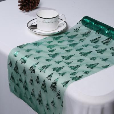 China Hot foil organza 100%nylon running table runner roll for christmas table cover for sale