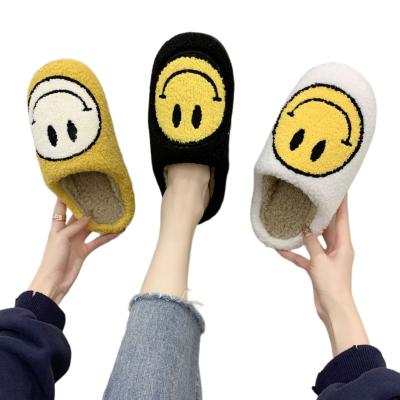 China Women's cute thick bottom cartoon non-slip smile slippers home autumn and winter plush cotton slippers face lovely gift for sale